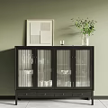 Black Sideboard With Glass Doors Drawers And Decorative Potted Plant On Green Wall