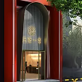 Modern Storefront With Red Columns Gray Striped Wall Golden Circular Logo Entrance Lighting And Trees