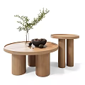 Wooden Round Coffee Tables Featuring Vase With Green Plant And Bowl Of Nuts