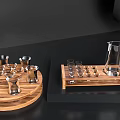 Elegant Glass Wine Bottle And Multiple Glasses Arranged On Wooden Serving Trays