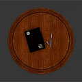 Round Red Wooden Table Top With Black Notebook Pen And USB Drive