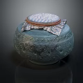 Blue Green Ceramic Jar With Carved Patterns And Lid Featuring Patterned Fabric Brown Trim 3d model