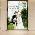 High End Wedding Photography Showcase Window With Bride Groom And Wedding Attire