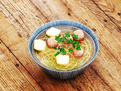 Bowl of Noodle Soup with Meatballs Butter Cubes and Fresh Parsley on Wooden Table 3d model