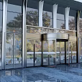 Modern Building Entrance Featuring Glass Curtain Walls Revolving Door And Metal Frames