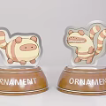 Cute Cartoon Ornament With Striped Tail And Base Displaying ORNAMENT Text