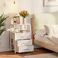 White Tiered Storage Shelf in Bedroom with Vase Flowers Photo Frame Alarm Clock and Books