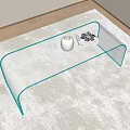 Sleek Glass Coffee Table With Curved Legs On Soft Carpet And Decorative Vase