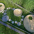 Outdoor Circular Leisure Areas With Green Grass Trees And Paths