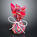 Colorful Patterned Food Gift Package Tied With White Ribbon Bow