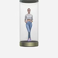Transparent Cylindrical Container With Female Model In White Top And Blue Jeans