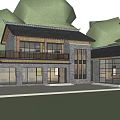 Modern Traditional Boutique Guesthouse Building with Stone Exterior Large Glass Windows and Lush Greenery