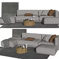 Light Gray Sectional Sofa With Brown Pillows Knitted Blanket And Wooden Coffee Table