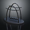 Modern Decorative Ornament Set With Black Arched Frame Hanging Metal Balls And Circular Base