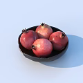 Fresh Ripe Red Pomegranates In Black Bowl On Light Blue Background