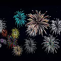 Colorful Fireworks Blooming Brightly Against Dark Night Sky For Celebration Event