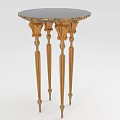 Ornate Round Accent Table With Golden Carved Legs And Dark Surface
