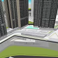 Modern Commercial Complex With Tall Glass Curtain Wall Buildings And Surrounding Greenery