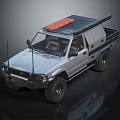 Silver Off Road Pickup Truck With Roof Rack And Orange Cargo On Top