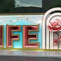 Decorative Building Exterior Wall With LIFE Lettering Golden Frame Rose Motifs And Arched Design