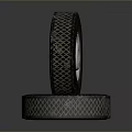 Stacked Tires With Diamond Pattern Tread And White Metal Rims 3d model