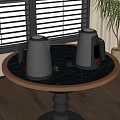Stainless Steel Electric Kettles on Black Marble Round Tabletop with Window Background