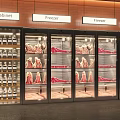 Modern Retail Freezer Display With Glass Doors For Organized Meat Storage And Wine Cabinet