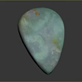 Polished Turquoise Stone Teardrop Ornament With Yellow Spots And Smooth Glossy Surface