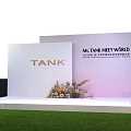 Elegant Car Showroom with Starry Sky Backdrop Floral Decorations Green Lawn and TANK