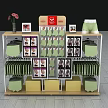Multi Tiered Display Shelf With Green Boxes Photo Frames Vase And Shorts Model 3d model