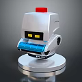 Silver Robot Device With Red Top Yellow Eyes Blue Components Round Base And M10 Label