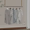Modern Metal Hanger Rack With Gray White Shirts In Bright Room Corner