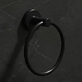 Black Round Ring Metal Door Handle On Dark Gray Cracked Textured Wall