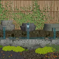 Stone Water Features In Garden With Bamboo Fence Orange Koi Fish And Aquatic Plants