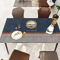 Dining Table Set With Blue Houndstooth Tablecloth Golden Plates Wine Glass And Brown Chairs