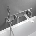 Wall Mounted Bathroom Faucet with Handheld Shower Above White Bathtub on Gray Wall