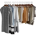 Various Fashionable Clothes Hanging On Hangers With Striped And Solid Color Styles
