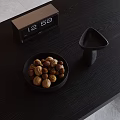 Decorative Ornament Set with Digital Clock Bowl of Nuts and Triangular Decor on Black Table 3d model