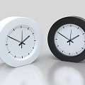 Modern Round White and Black Clocks with Minimalist Design on Sleek Surface