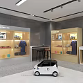 Modern Retail Store Interior With Display Cases Showcasing Clothing Shoes And Small Electric Car