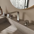 Modern Bathroom Faucet On Concrete Countertop With Round Mirror And Skincare Products
