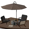 Outdoor Round Table With Fire Pit And Chairs Under Umbrella On Wooden Deck