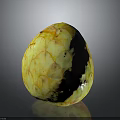 Yellow Textured Sugar Apple Fruit on Gray Reflective Background Surface
