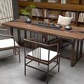 Chinese Style Wooden Tea Table and Chairs with Tea Set Green Plant and Bookshelf