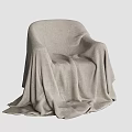Soft Light Gray Blanket Draped Over Comfortable Chair With Cozy Texture