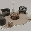 Curved Gray Sofa Set With Round Coffee Table Pillows Patterned Chair Floor Lamp And Rug