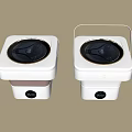 Two White Square Washing Machines With Black Circular Control Panels And Transparent Lids