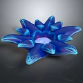 Blue Sea Anemone With Petal Like Structures And Translucent Body On Dark Background