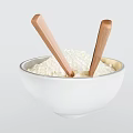 White Bowl Filled With Cooked Rice And Wooden Chopsticks Inside