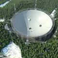Large Radio Telescope With Circular Dish Antenna Surrounded By Forest Trees